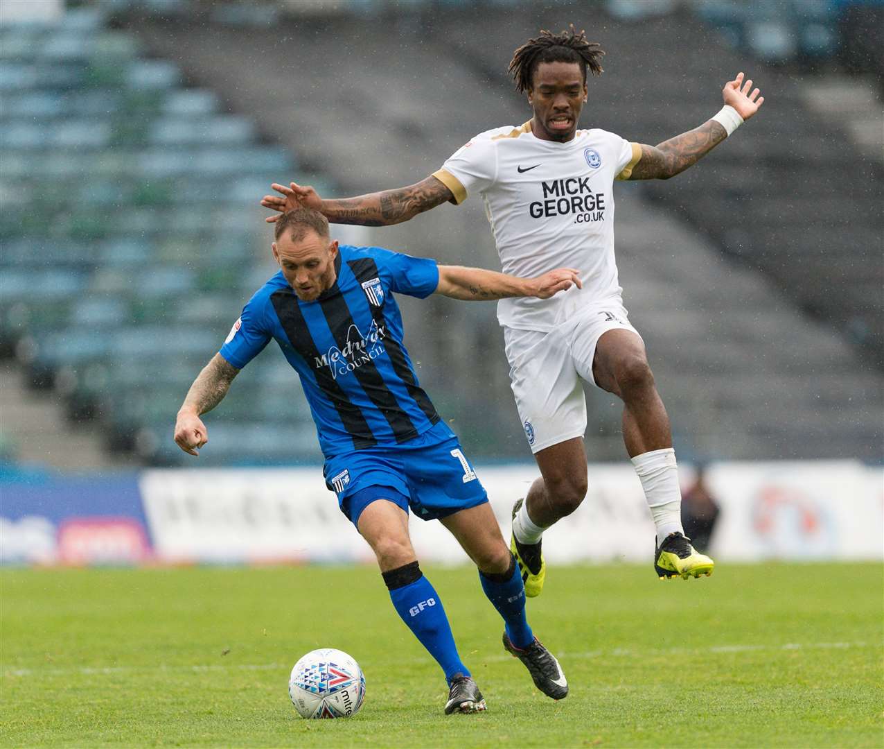 Barry Fuller escapes from Ivan Toney last season when Peterborough won 4-2 at Priestfield Picture: Ady Kerry