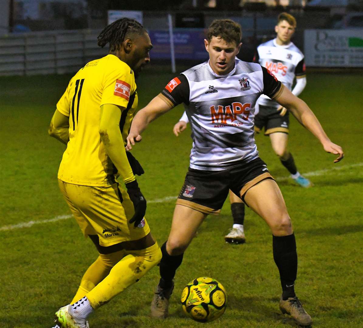 Sheppey's Gil Carvalho up against Deal's Max Niblett. Picture: Marc Richards