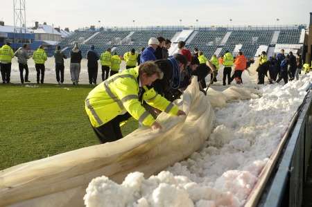 Clearing the Priestfield pitch at Gillingham