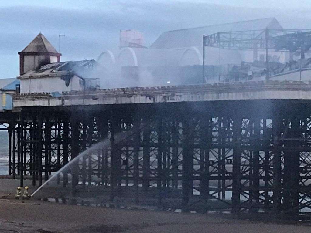 Firefighters working to put out a blaze on Blackpool Pier (Lancashire Fire and Rescue Service/PA)