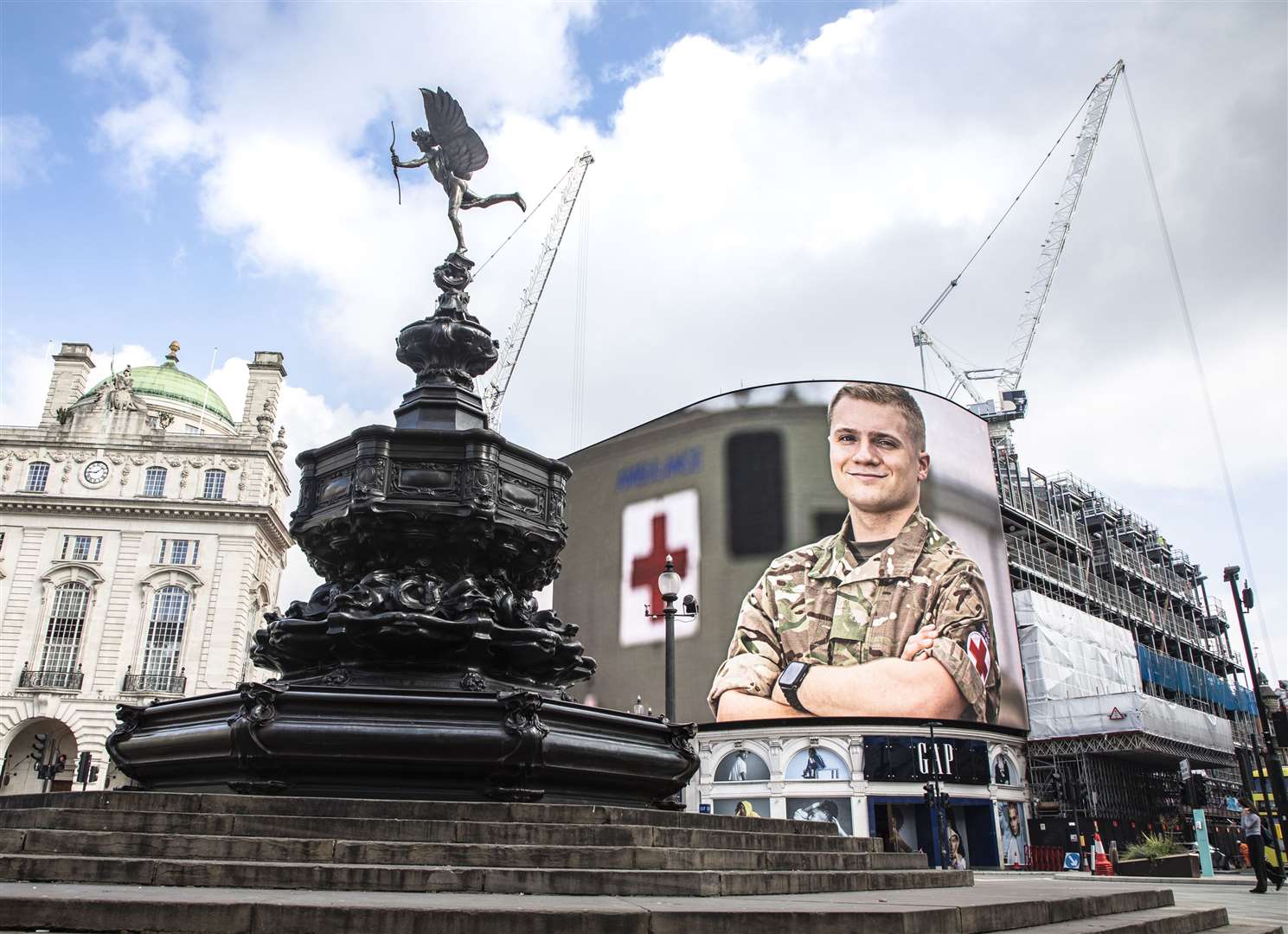 Portraits of Armed Forces personnel appeared on the billboards of Piccadilly Circus (SAC Beth Roberts RAF/MoD)