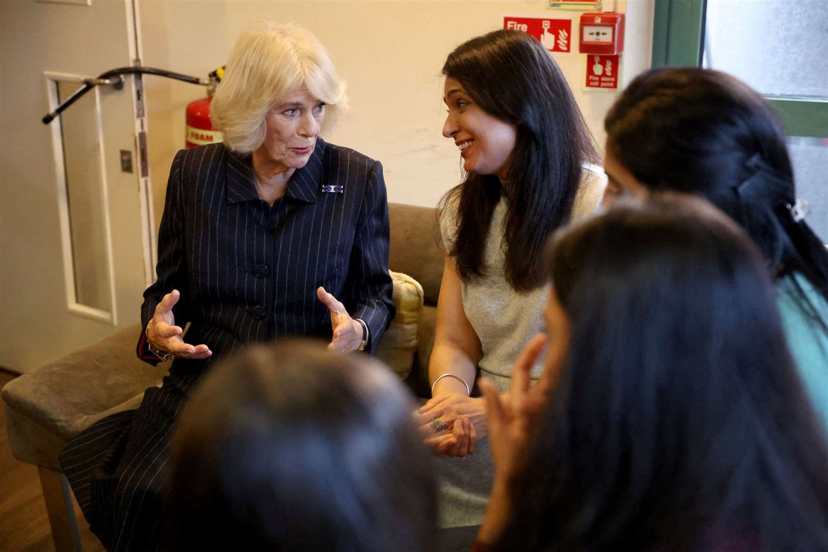 Camilla spoke to staff and former and current residents at the women’s refuge (Hannah McKay/PA)