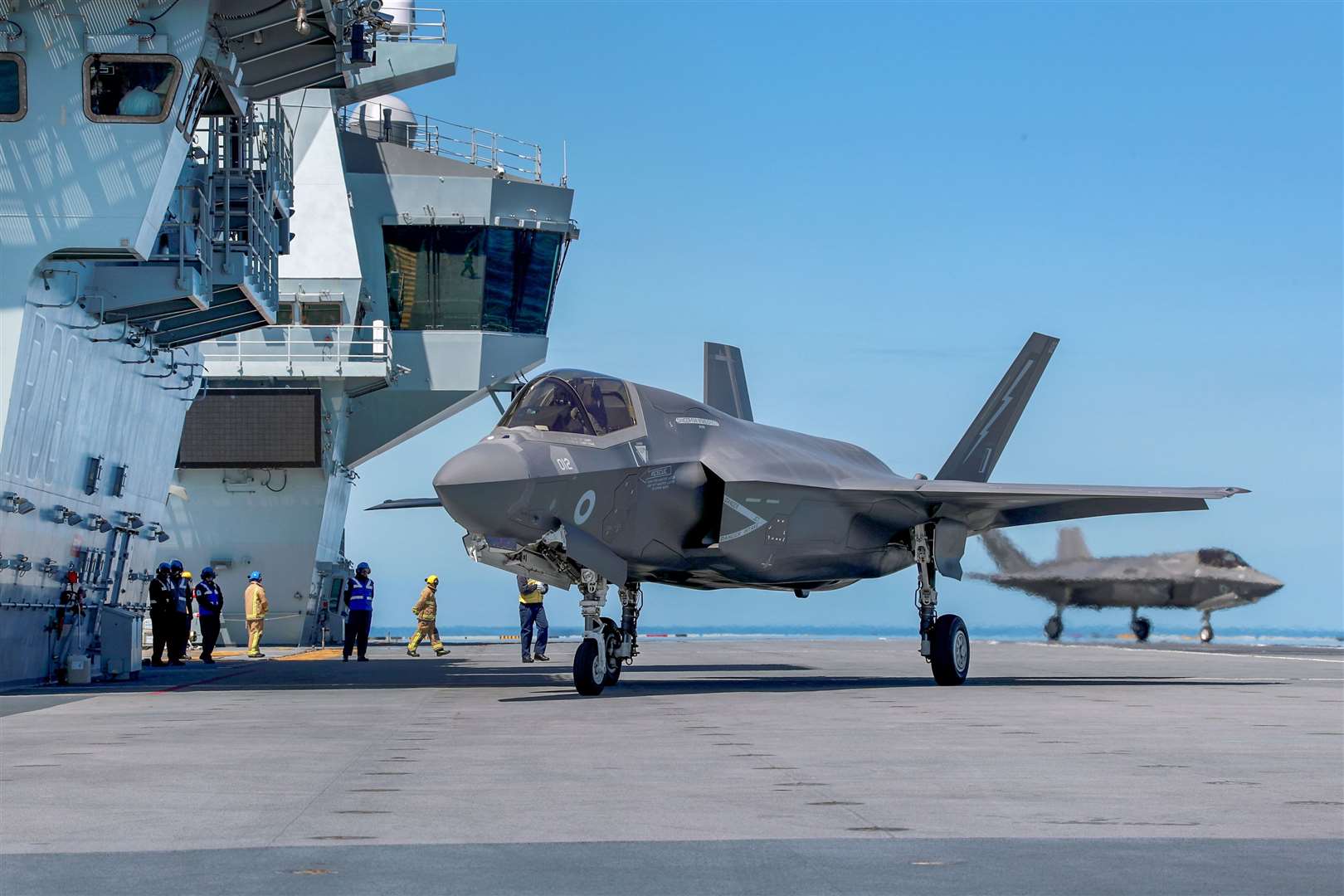 One of four operational F-35B Lightning jets lands on HMS Queen Elizabeth for the first carrier sea training (Royal Navy/MoD/PA)