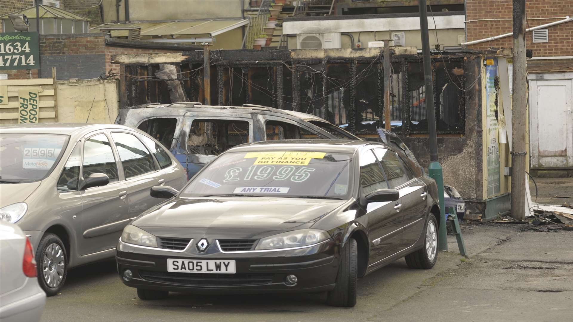 Several cars and a building were destroyed by the flames.