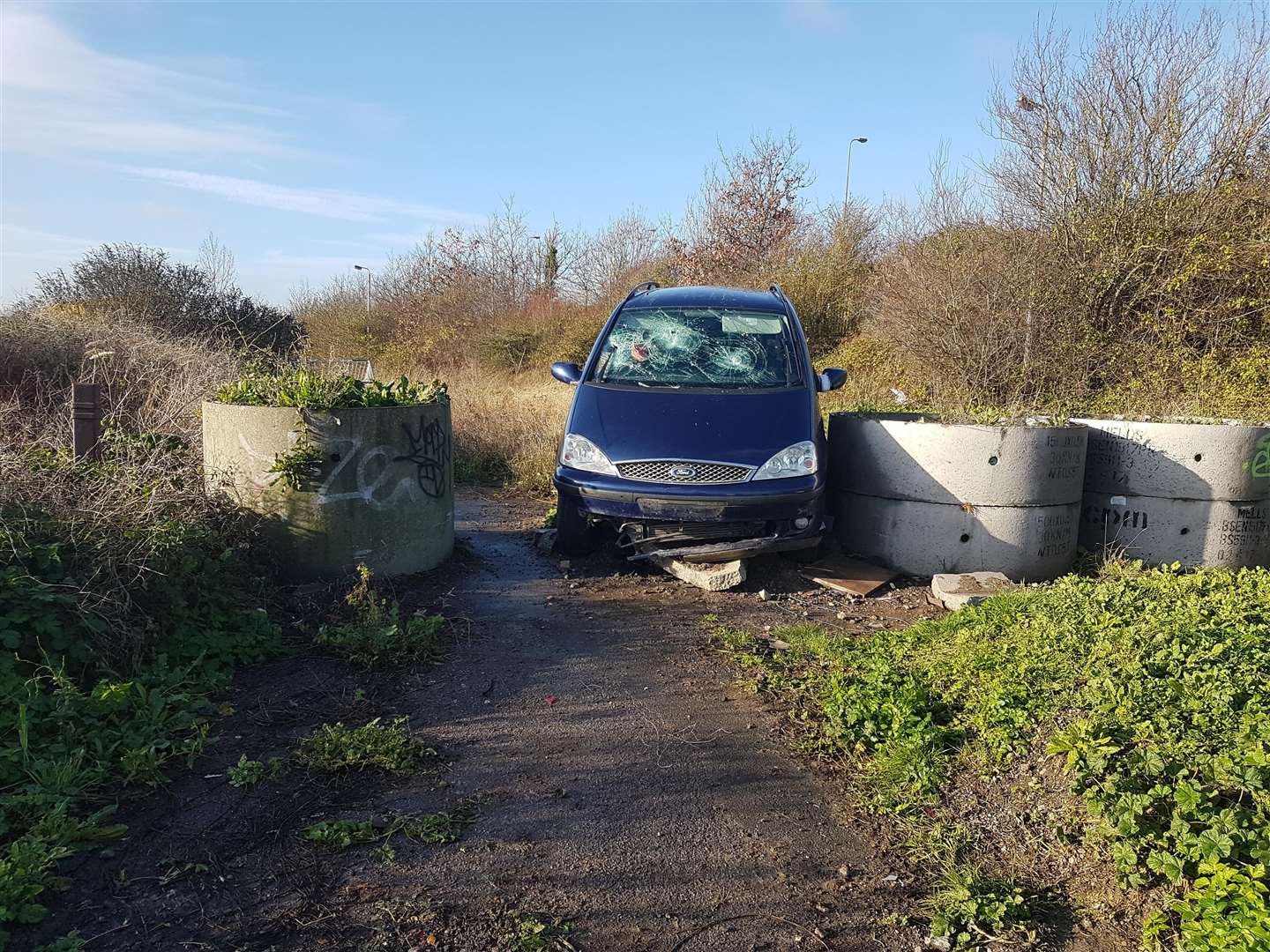 A Ford Galaxy among the rubble