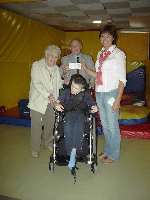 Brenda and Tom Holding present a cheque to Jane Jarmaine of Preston Skreens while Joseph Peuart looks on