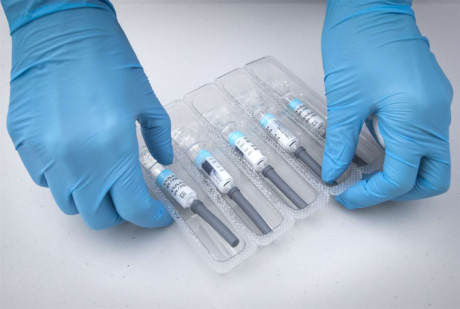 A nurse prepares flu vaccine jabs (Jane Barlow/PA)