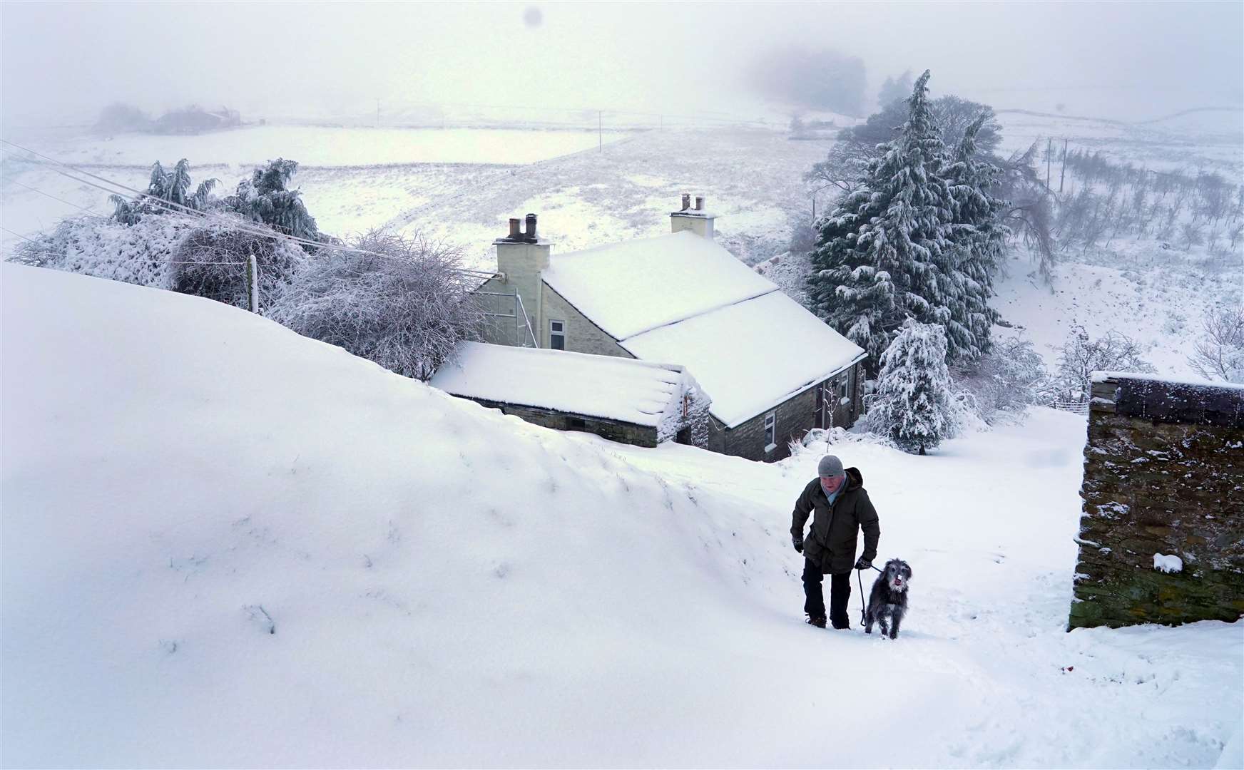 Deep snow in the Pennines makes the morning walk heavy going (Owen Humphreys/PA)