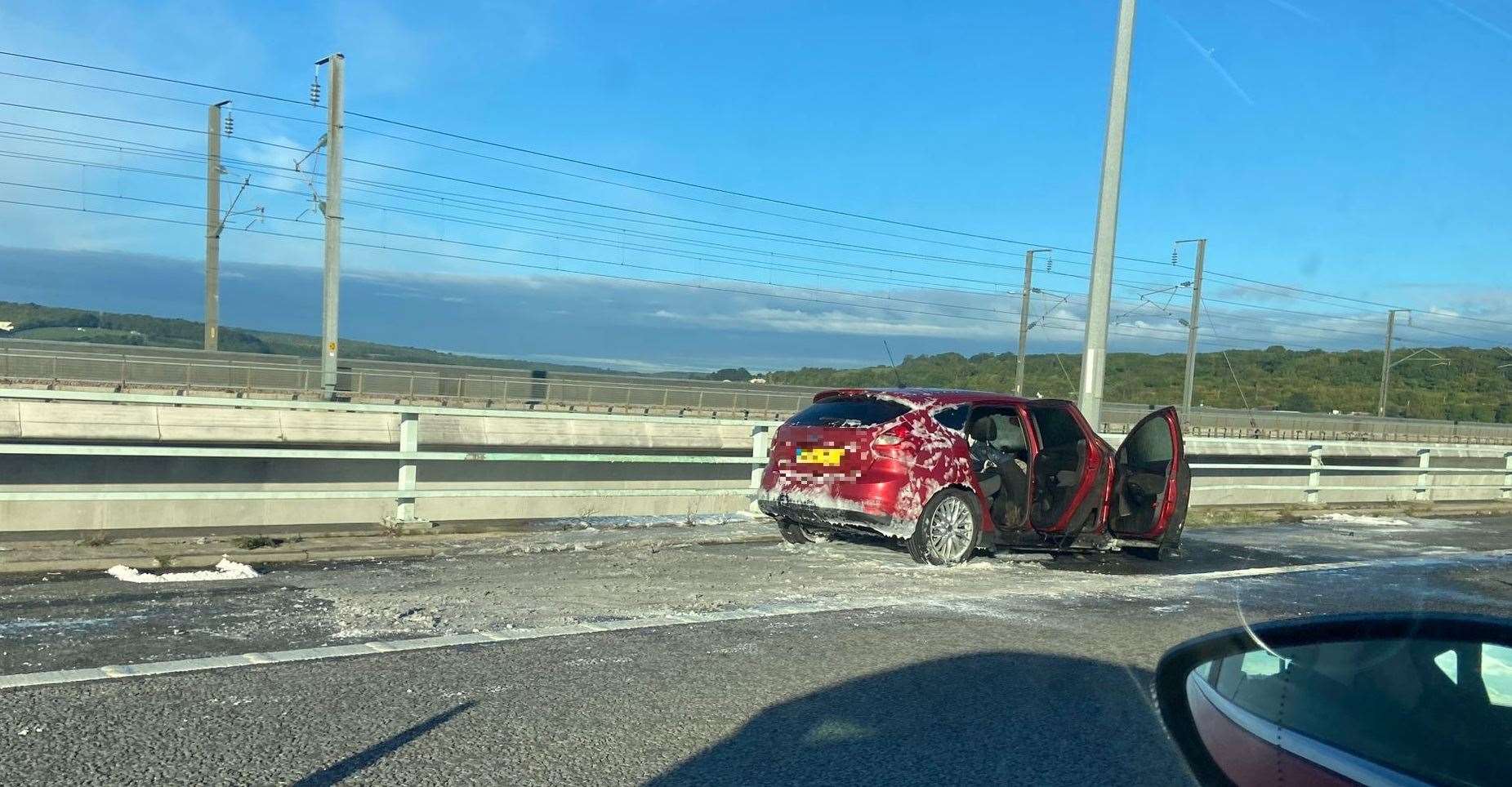 The car that was on fire on the Medway Bridge. Picture: Megan Carr