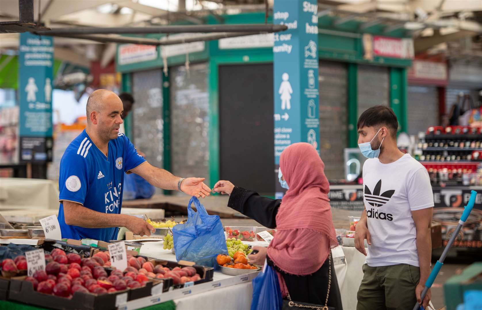 People shopping at Leicester market (Joe Giddens/PA)