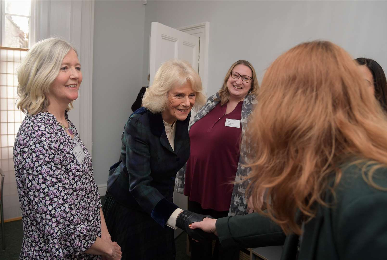 The Duchess of Cornwall, meeting domestic abuse survivors during a visit to Bath-based charity Voices earlier this year (Finnbar Webster/PA)