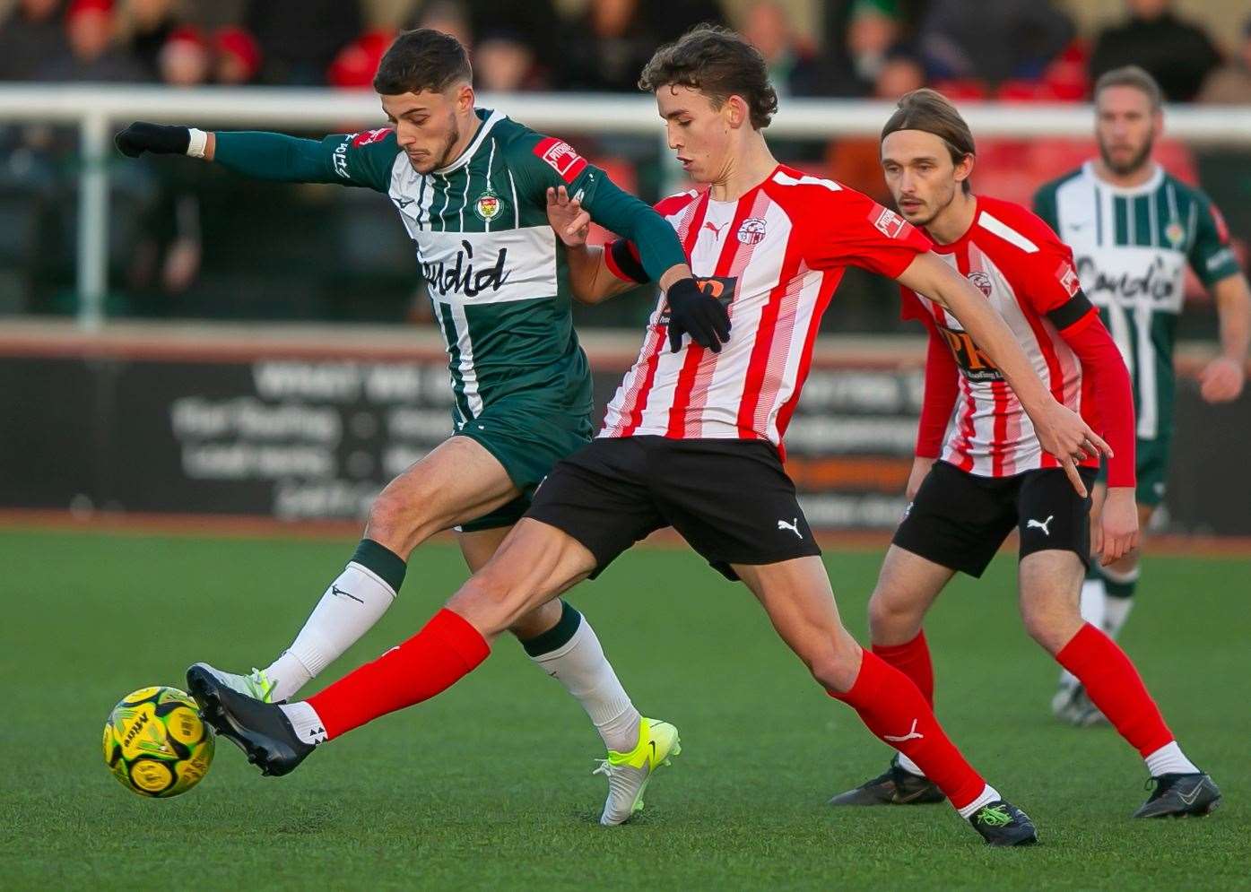 Ashford United forward Louis Collins looks to get away from his man at Sheppey. Picture: Ian Scammell