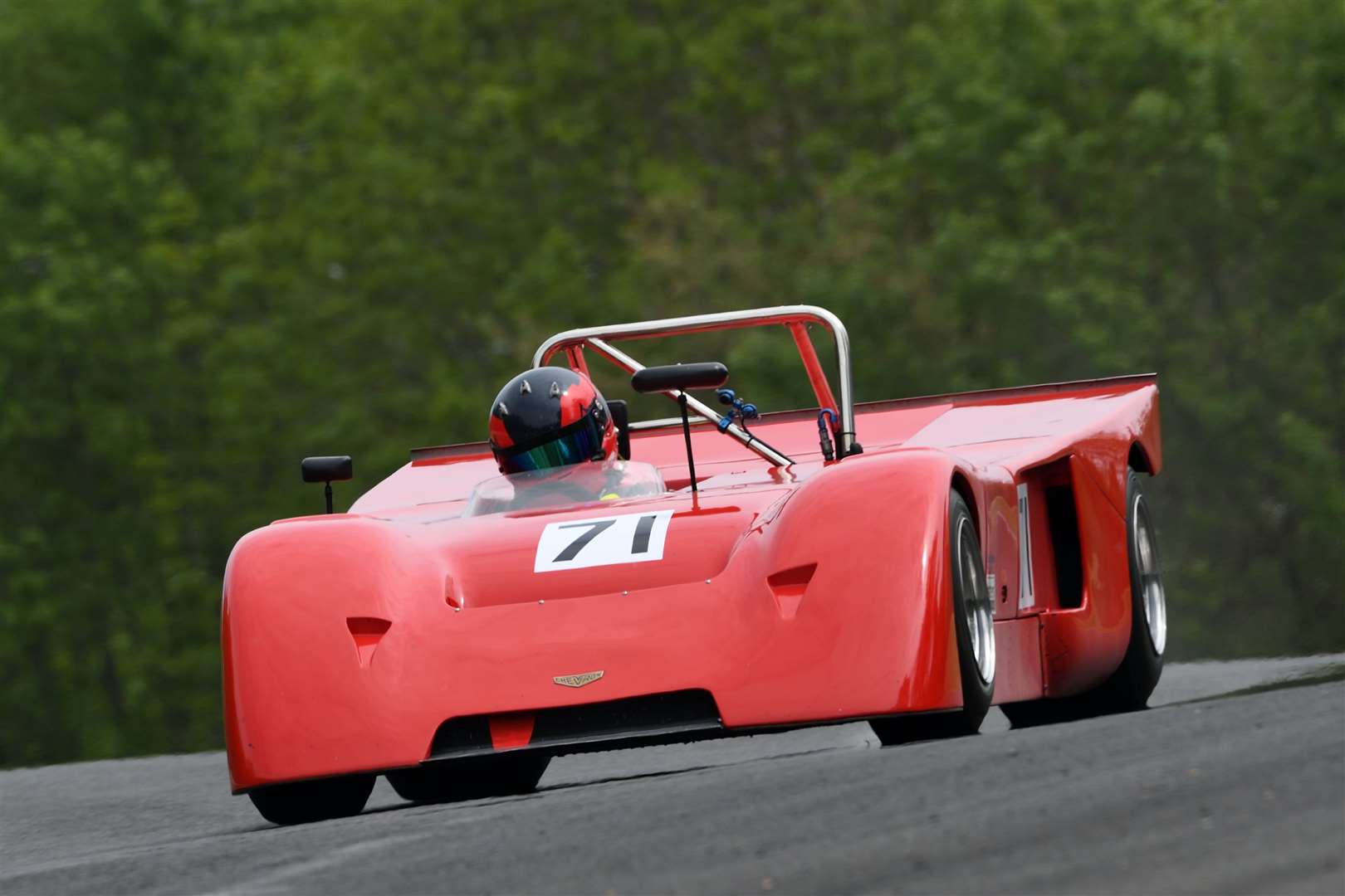 Jonathan Mitchell crashed heavily out of the Historic Sports Cars race, in his Chevron B19. His car flipped over the barriers at Hawthorn bend but he suffered no injuries. Picture: Simon Hildrew