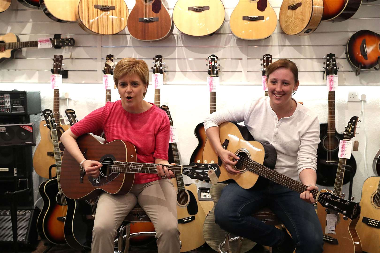 Former first minister Nicola Sturgeon and Mhairi Black strike up a tune in 2015 (Andrew Milligan/PA)