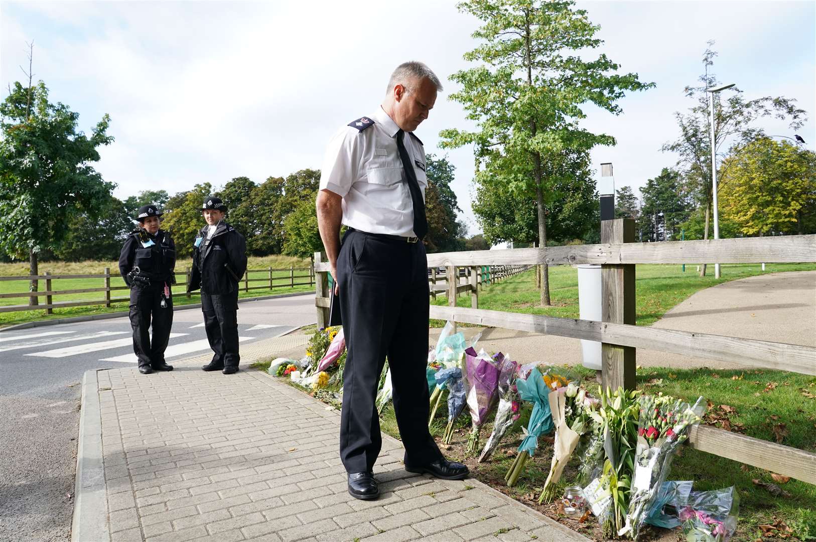 Chief Superintendent Trevor Lawry by the floral tributes at Cator Park in Kidbrooke, south London, near to the scene where the body of Sabina Nessa was found (Ian West/PA). 