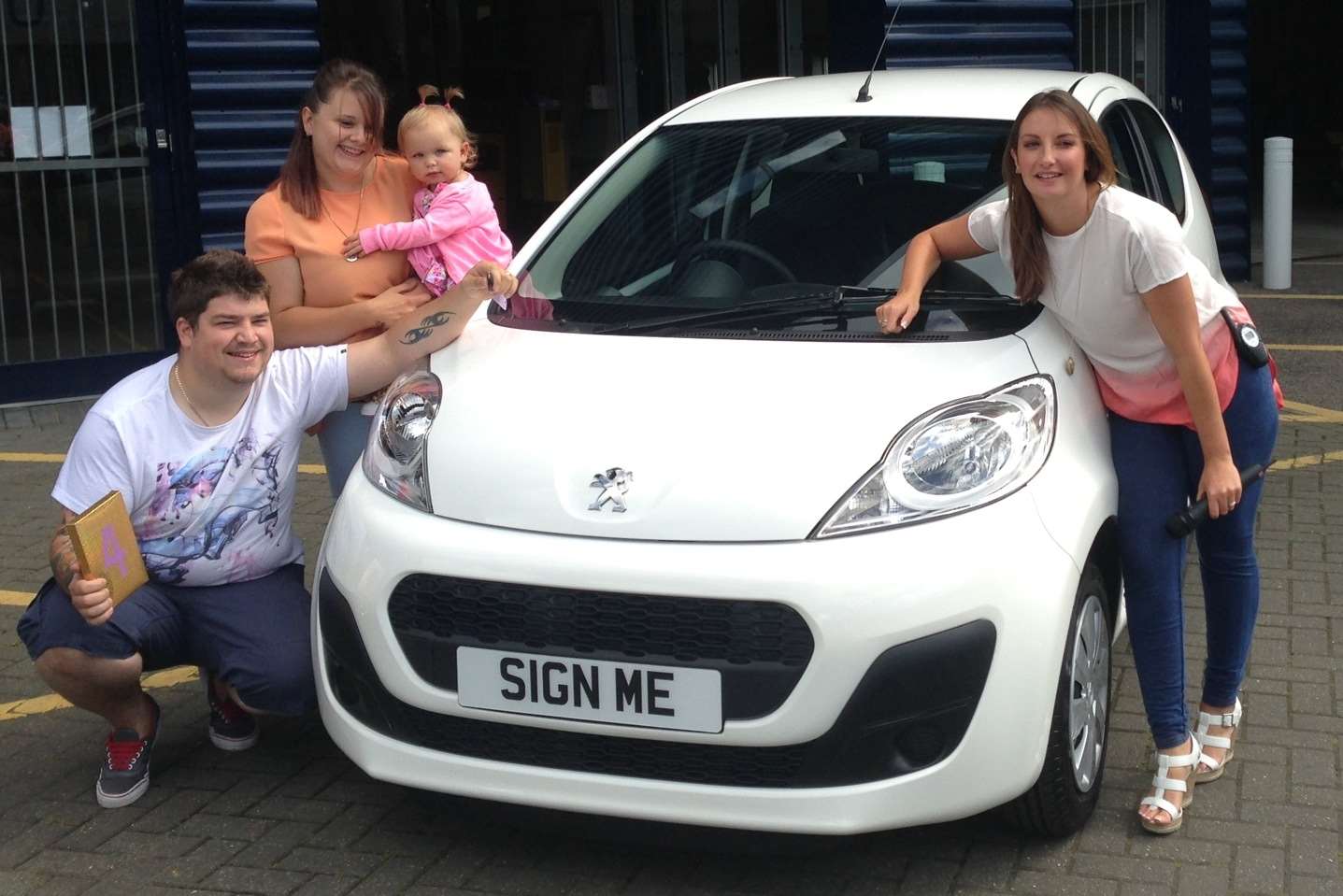 Winner Anthony Dighton with wife Toni Richards, 16 month old daughter Willow and kmfm presenter Emma Saint.