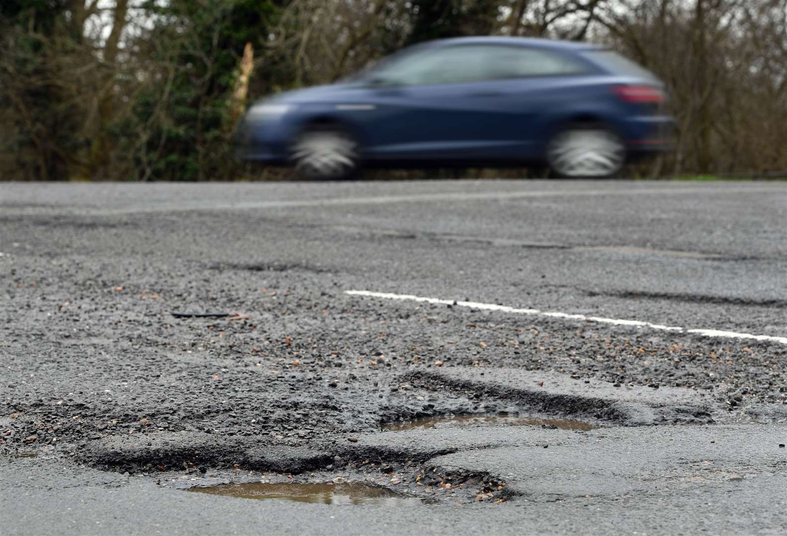 Road repairs are set to be further affected by a squeeze on council budgets (Joe Giddens/PA)