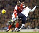 Jimmy Floyd Hasselbaink tussles with Pascal Chimbonda. Picture: MATTHEW WALKER
