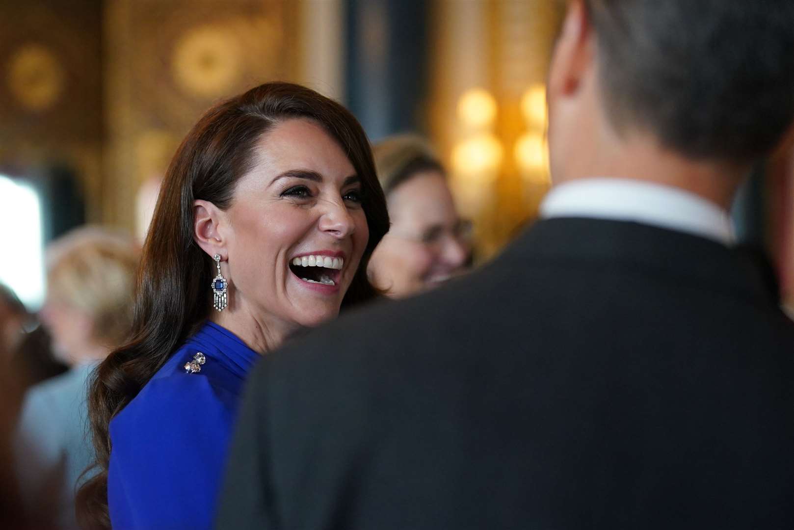 The Princess of Wales speaks talks to guests (Jacob King/PA) 