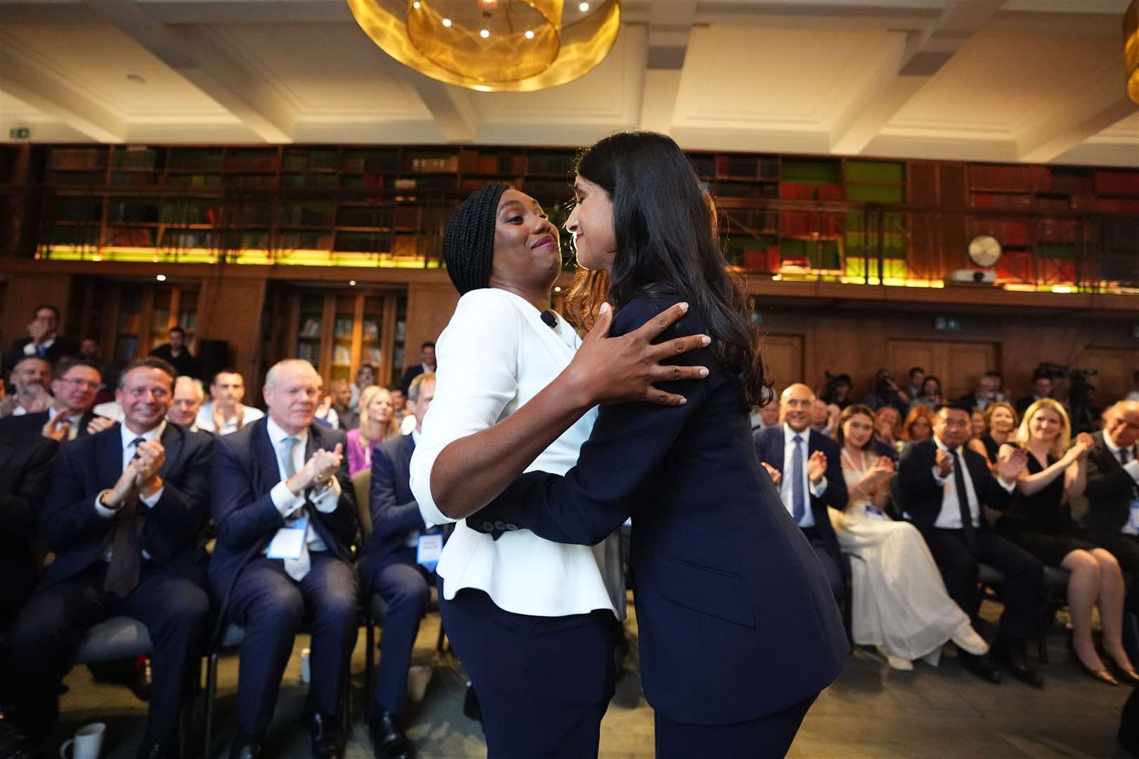 Kemi Badenoch is greeted by Claire Coutinho as she arrives to speak at a Conservative Party leadership campaign event at IET London (James Manning/PA)