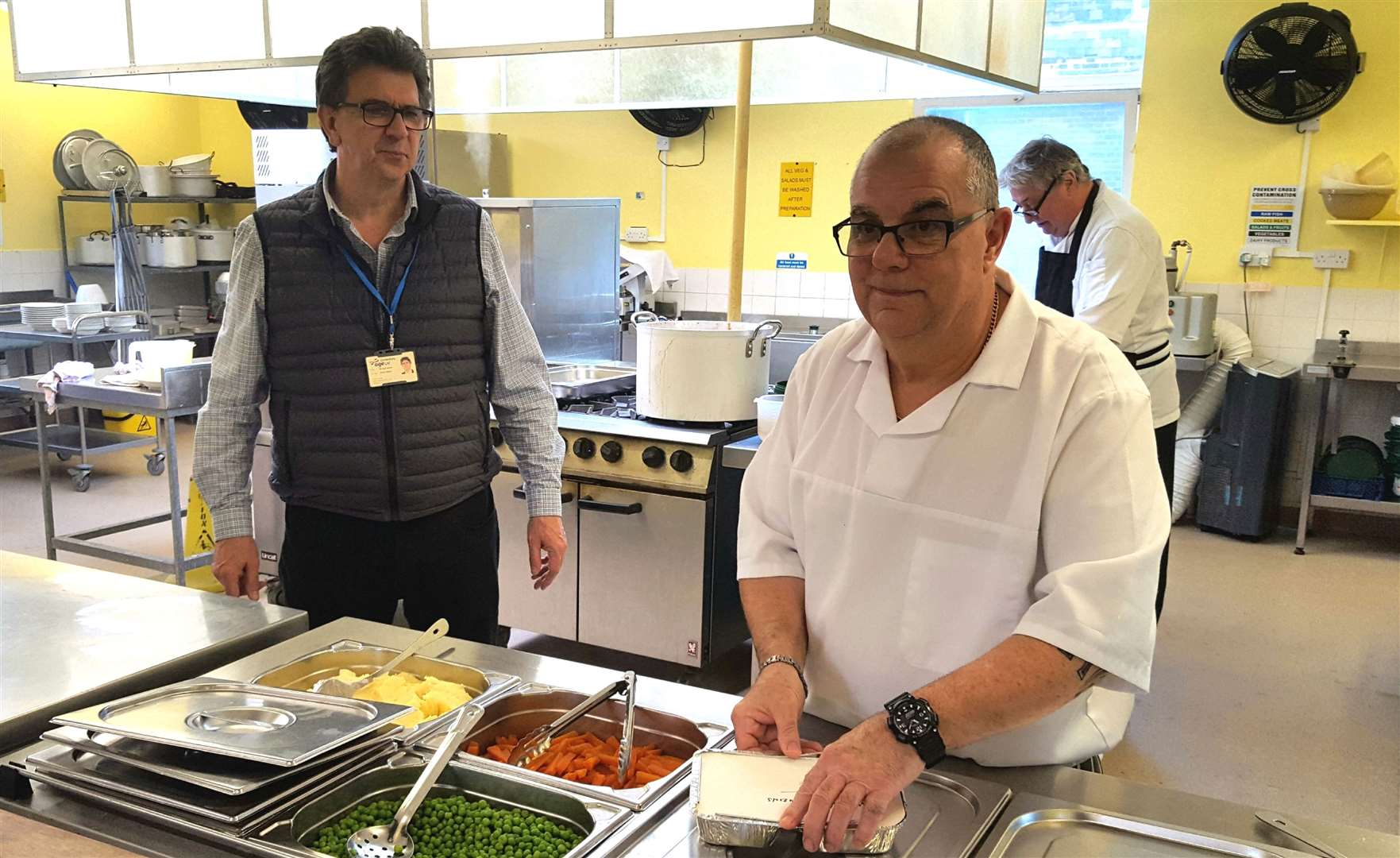 Dr Neil Brown watches head chef Dave Pilbeam preparing meals for delivery (31708733)