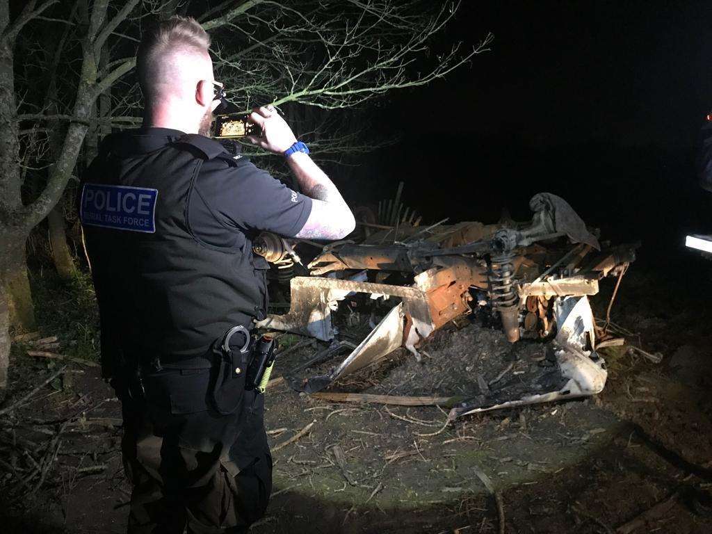 PC Nick Lingham with burnt out Land Rover (7546408)