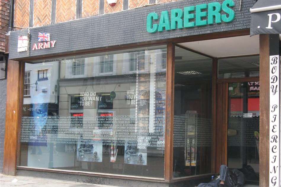 Offensive anti-police and military graffiti scrawled on the window of the Army  careers office in St Peters Street, Canterbury