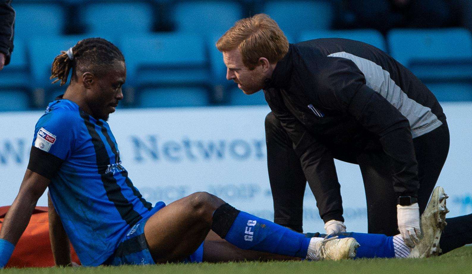 Gabriel Zakuani receives treatment on his injured ankle Picture: Ady Kerry