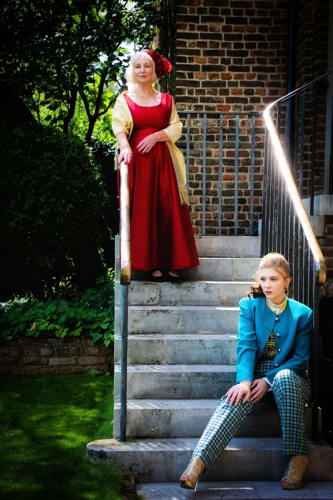 Wonderwall photo shoot at Restoration House, Rochester, for the Wisdom Hospice. Volunteer Tina Henbest from the Rochester shop at the top of the stairs with model Brogan Alexander. Picture: Lisa Kennedy