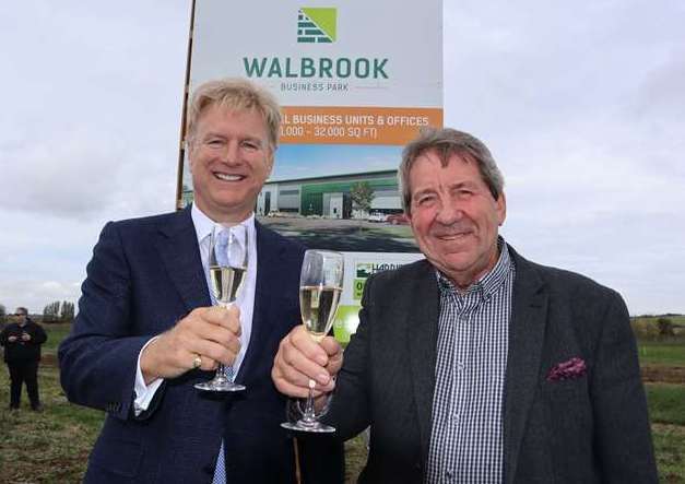 Tom Allsworth of Medichem, left, and MP Gordon Henderson toasting the launch of Walbrook Business Park at Neats Court, Queenborough