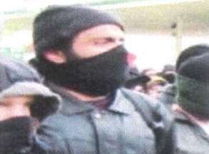 Masked Awad was filmed throwing a brick