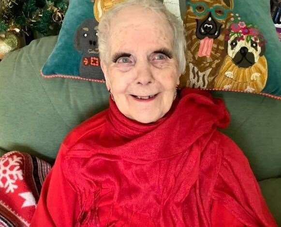 Betty Bullock,100, adorns some fake eye lashes for the camera