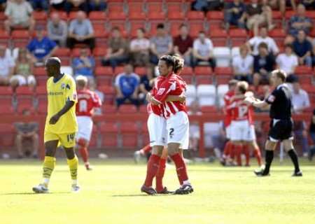 WINNER: Cheltenham celebrate the only goal of the game. Picture: MATT WALKER