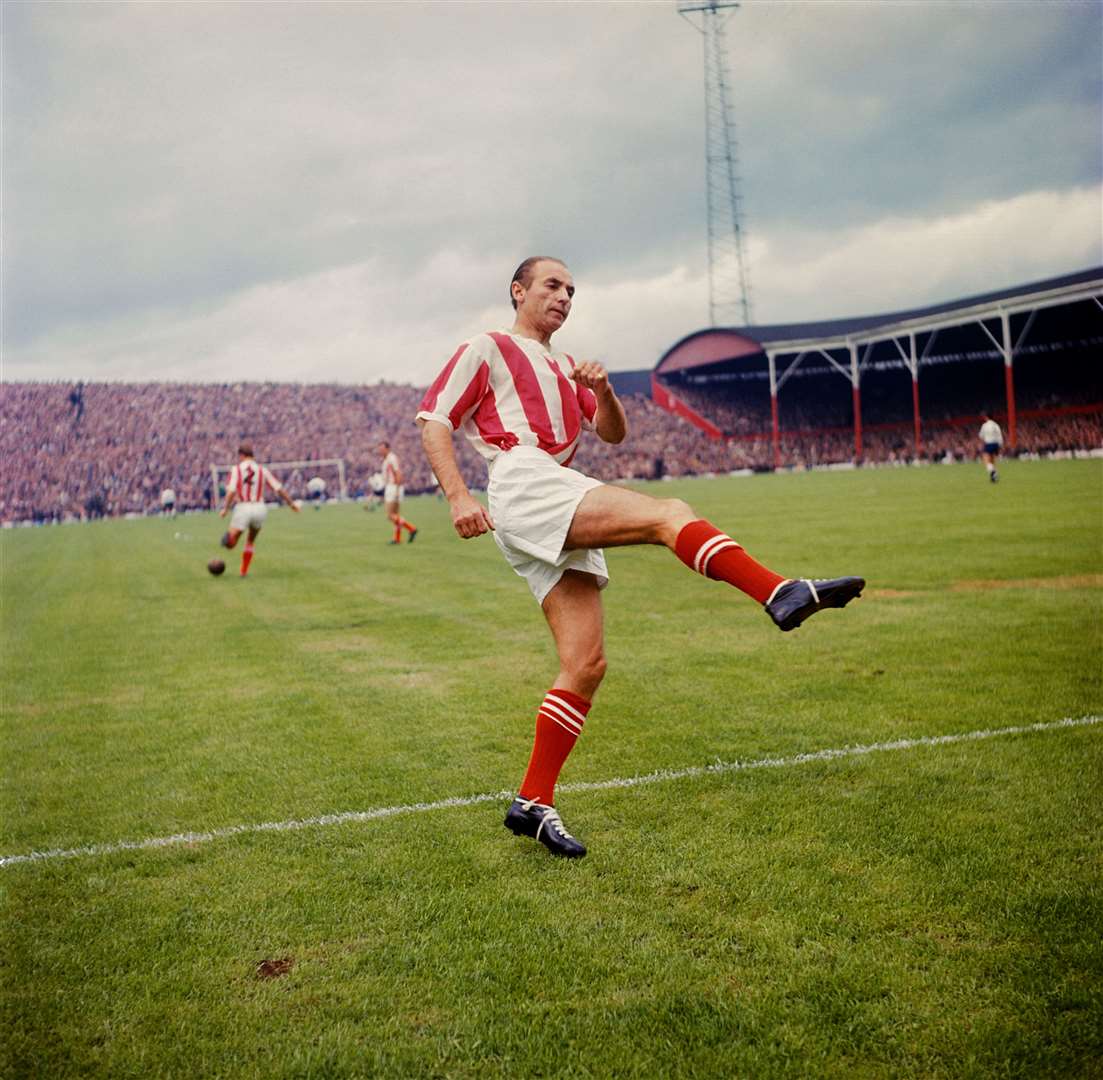 Stanley Matthews warms up before a Stoke City match in August 1963 (PA)