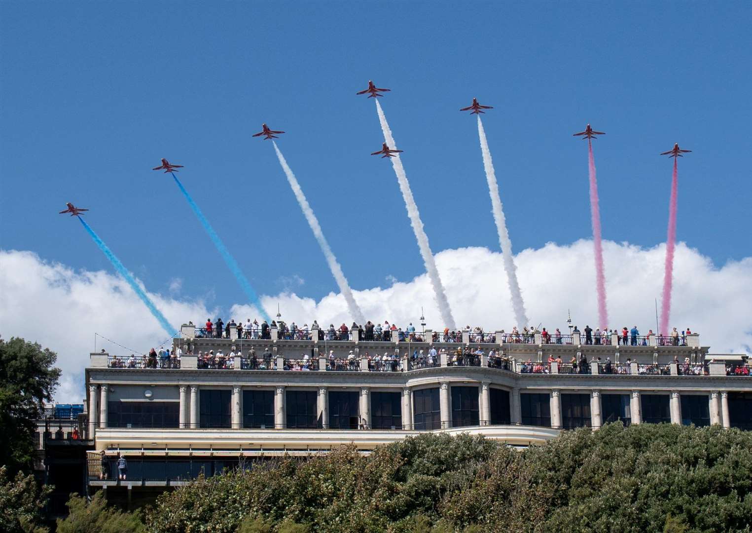 The Red Arrows flying over Folkestone last summer. Picture: FHDC