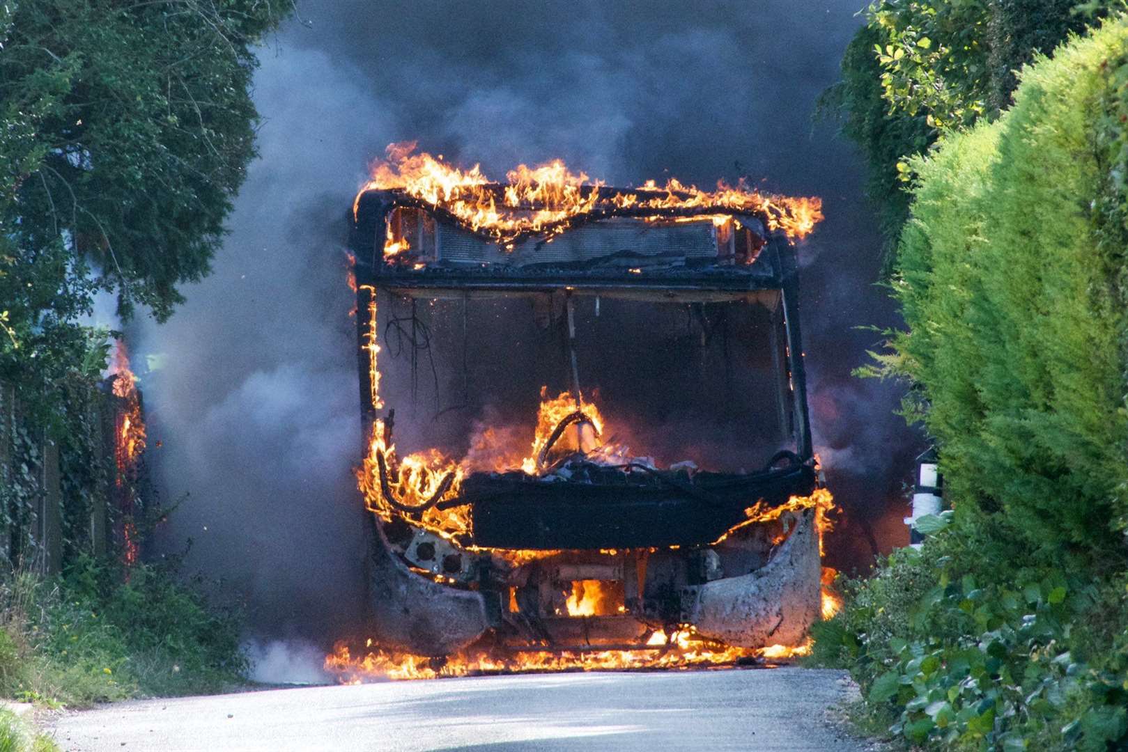 Flames consume the burning bus in Shepherdswell. Picture: UKNiP