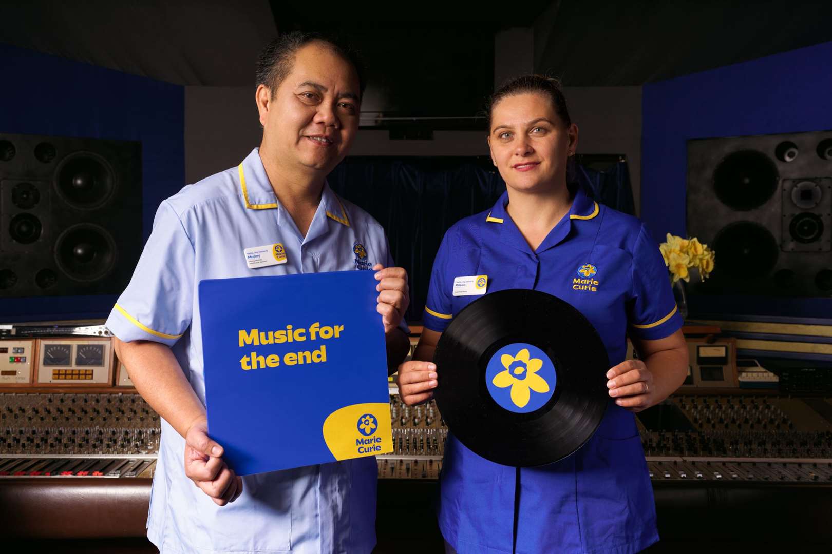 Marie Curie nurse Raluca Aparaschivei and healthcare assistant Manny Miranda (Ron Timehin/Marie Curie/PA)