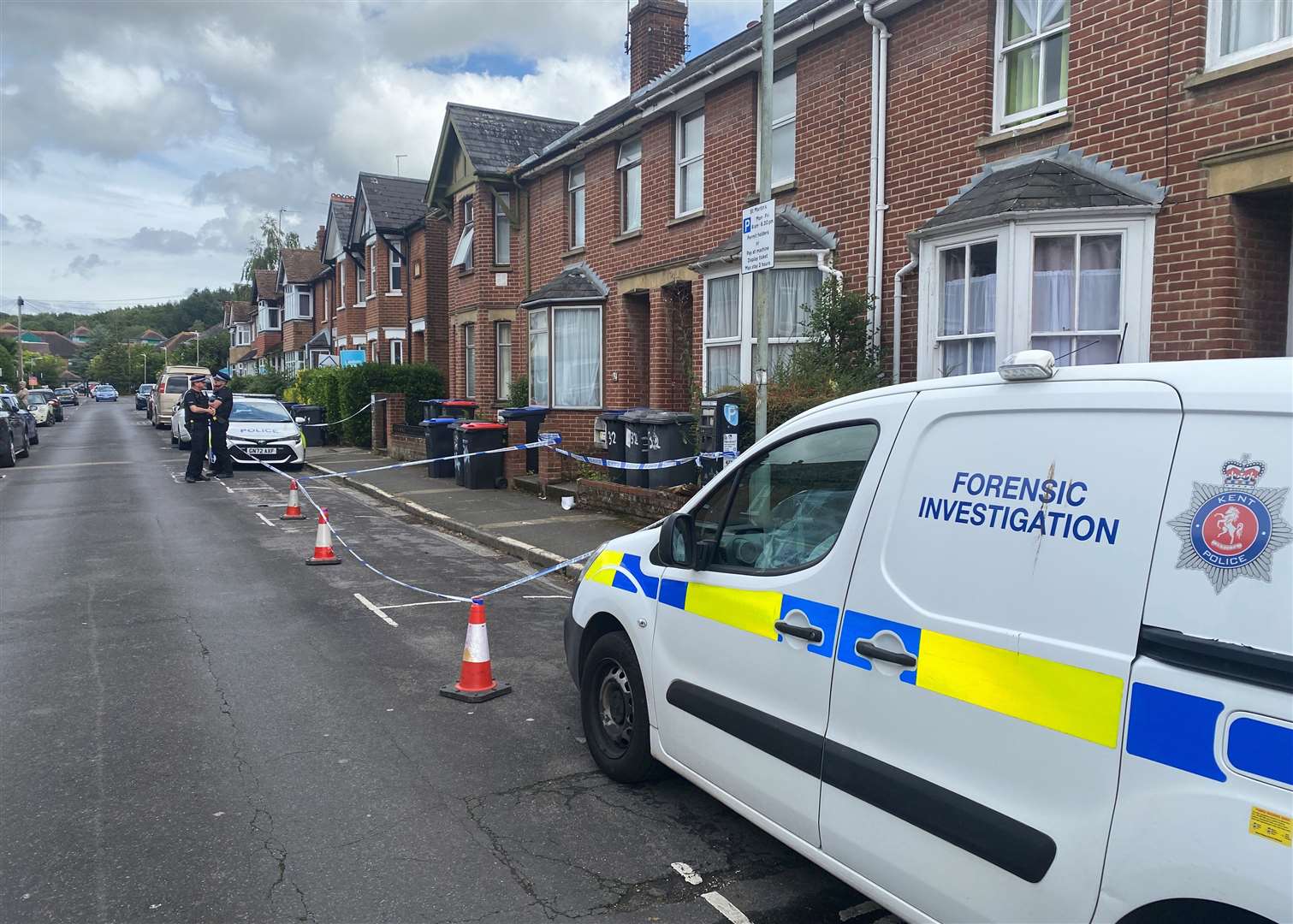 Police and forensics in St Martin's Road, Canterbury