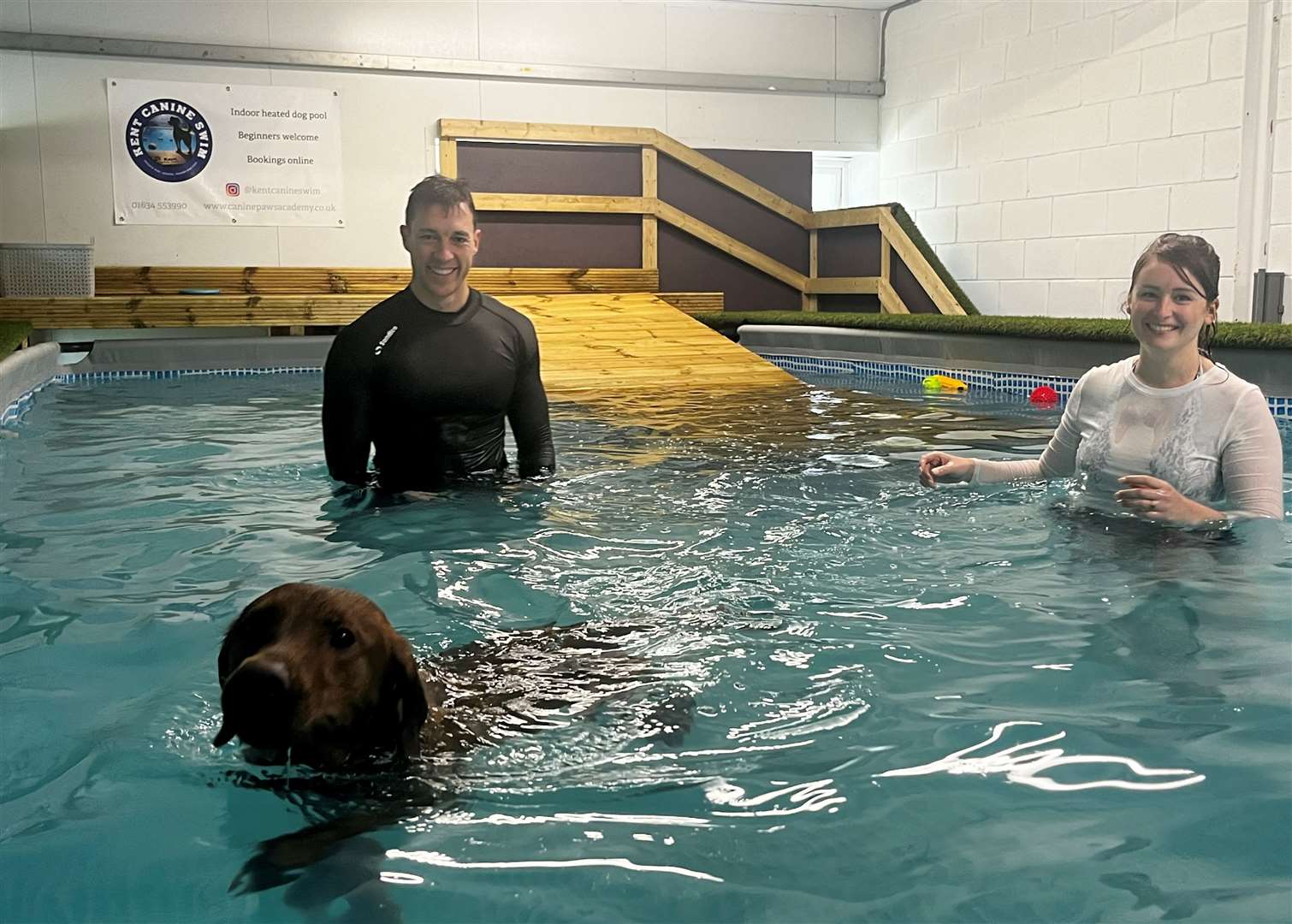 Cooper with his owners Devon Larnder-King and Mike McKee at Canine Paws Academy at Mockbeggar Business Park in Cliffe