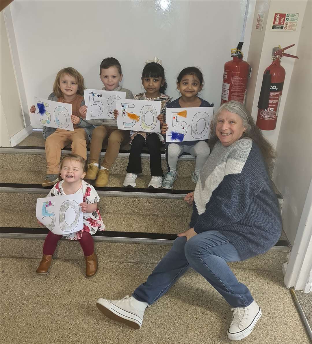 Some of the children with playgroup worker Tina. Photo: Kirsty Barden