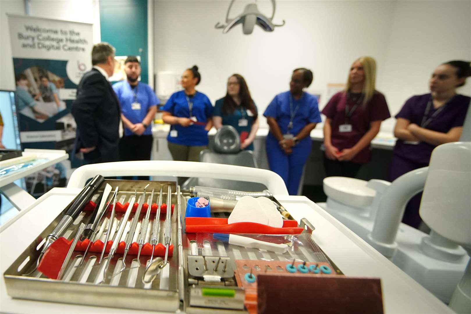 Labour leader Sir Keir Starmer (left) speaks to dental students and staff during a visit to Bury college in Lancashire, to see the learning facilities being used to train dental nurses of the future (Peter Byrne/PA)