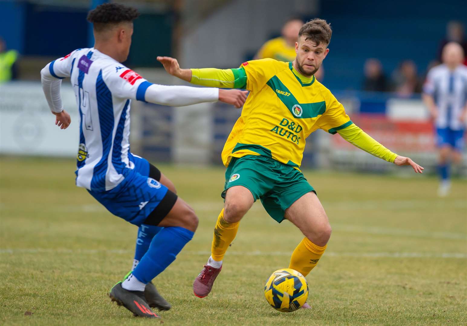 Ashford midfielder Henry Muggeridge wins possession. Picture: Ian Scammell