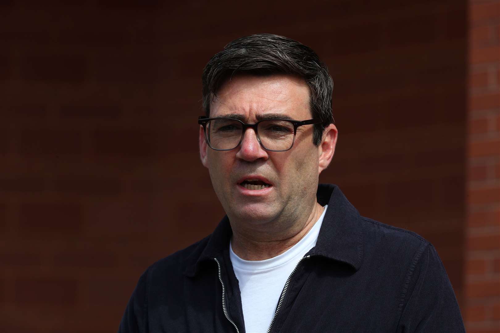 Andy Burnham has hit out at the ban, claiming it was imposed by the Scottish Government without consulting Greater Manchester authorities (Peter Byrne/PA)