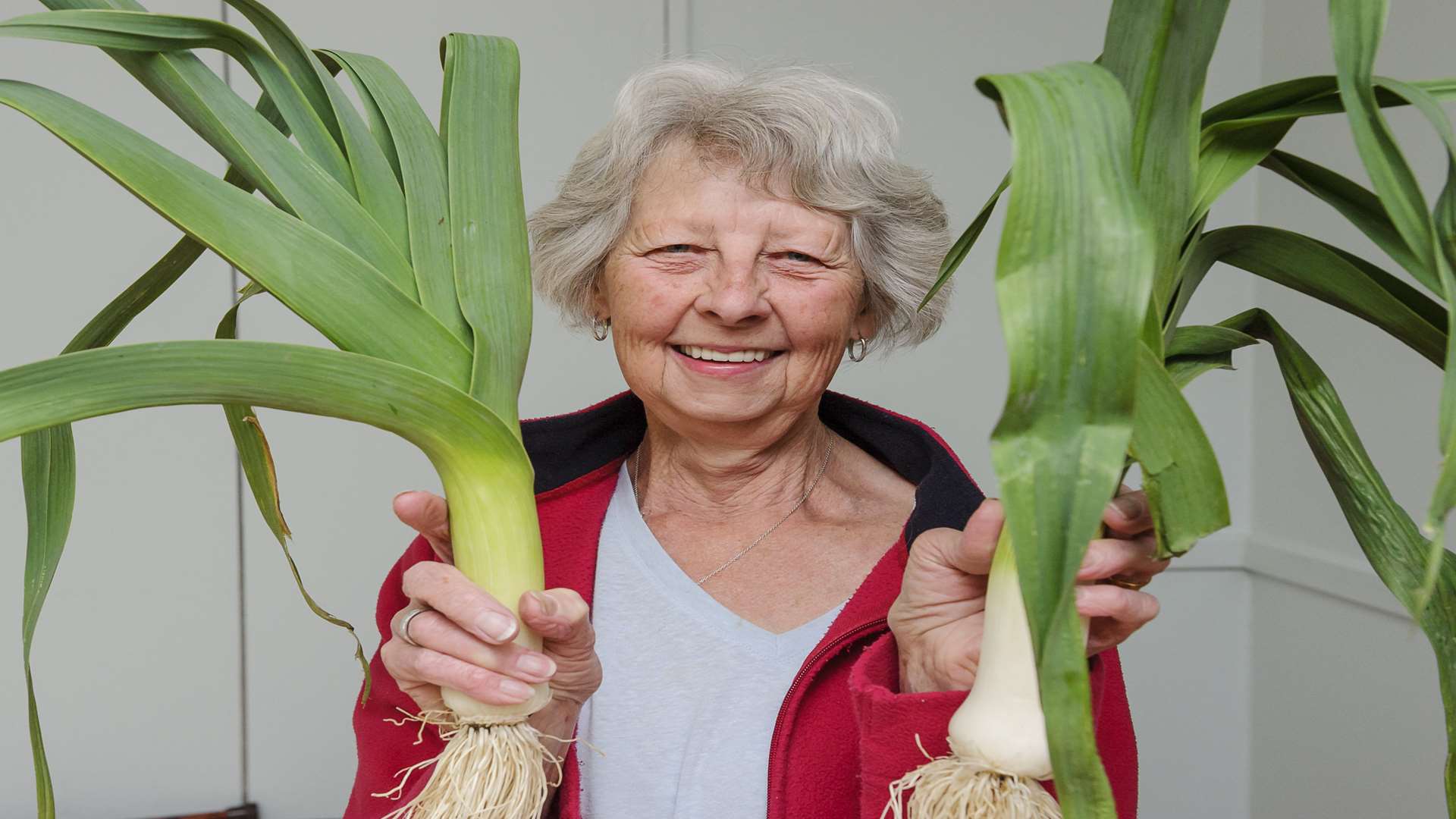 Irene Forder with leeks. Southfleet Gardeners Society spring show, at Southfleet village hall, Southfleet.