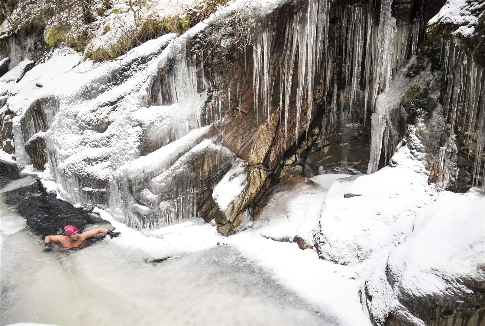 Ms Goodridge swimming in the freezing waters (Jane Barlow/PA)