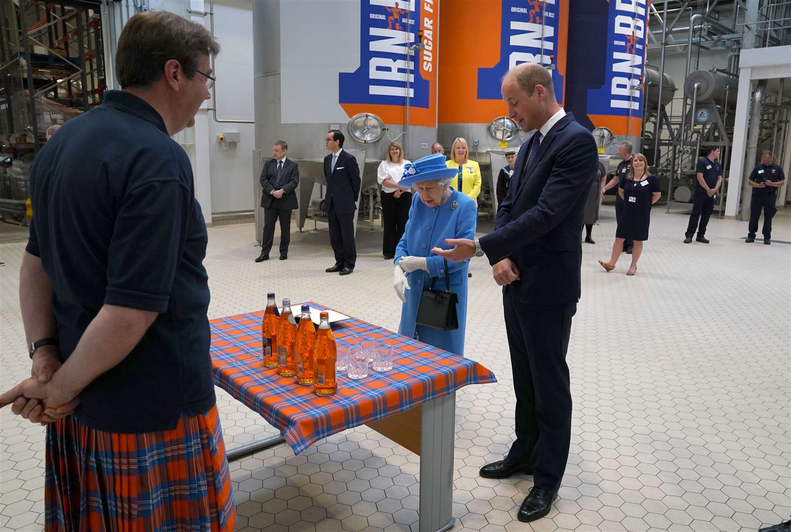 AG Barr commercial director Jonathan Kemp wore a kilt featuring the orange and blue Irn-Bru colours (Andrew Milligan/PA)