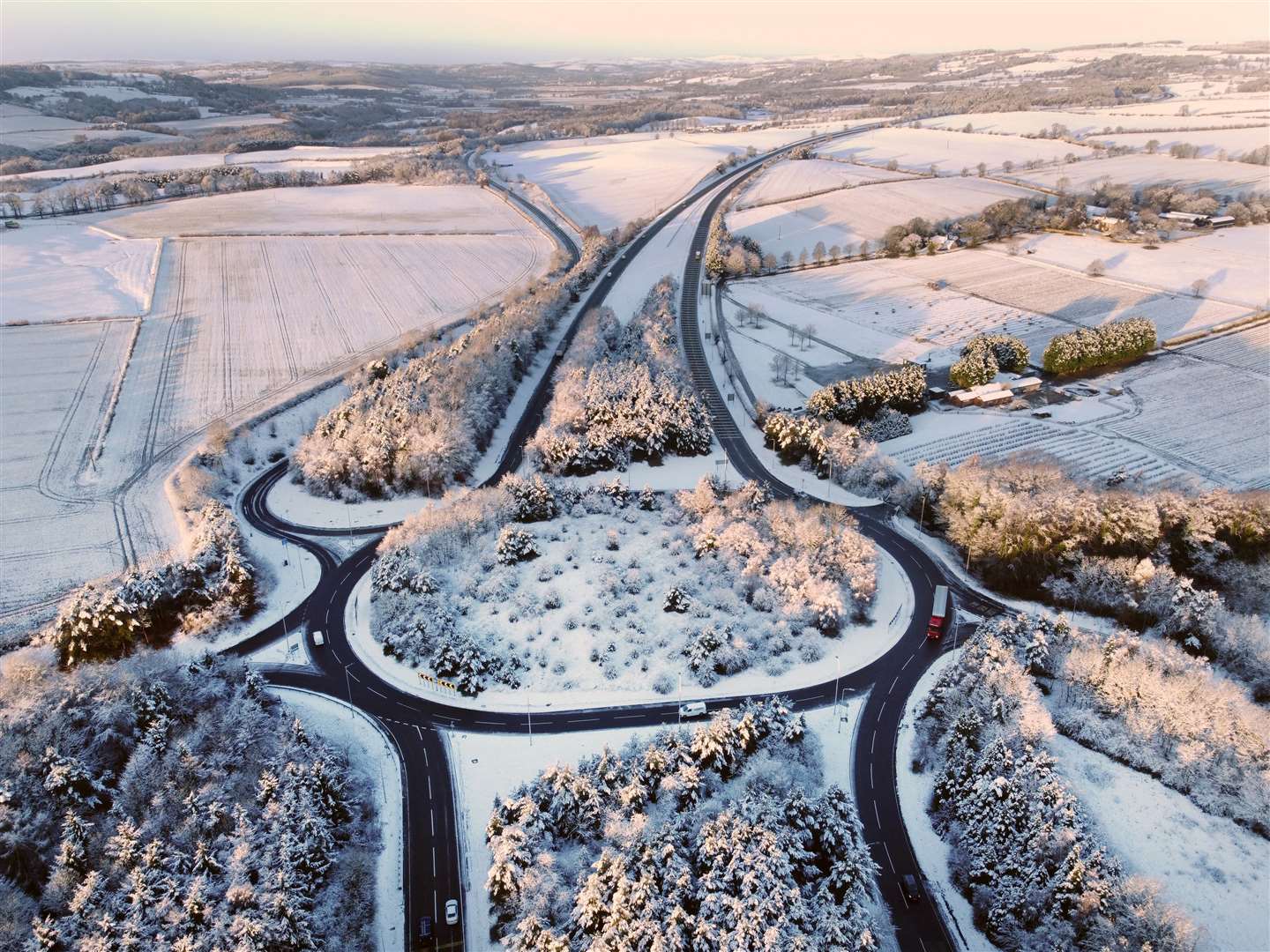 Freshly-fallen snow covers a roundabout on the A69 Corbridge bypass, near Hexham in Northumberland (Owen Humphreys/PA)