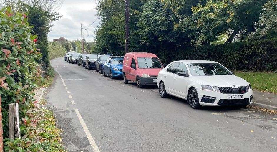 Cars parked outside Holywell Primary School in Forge Lane in Upchurch during school pick-up time. Picture: Joe Crossley