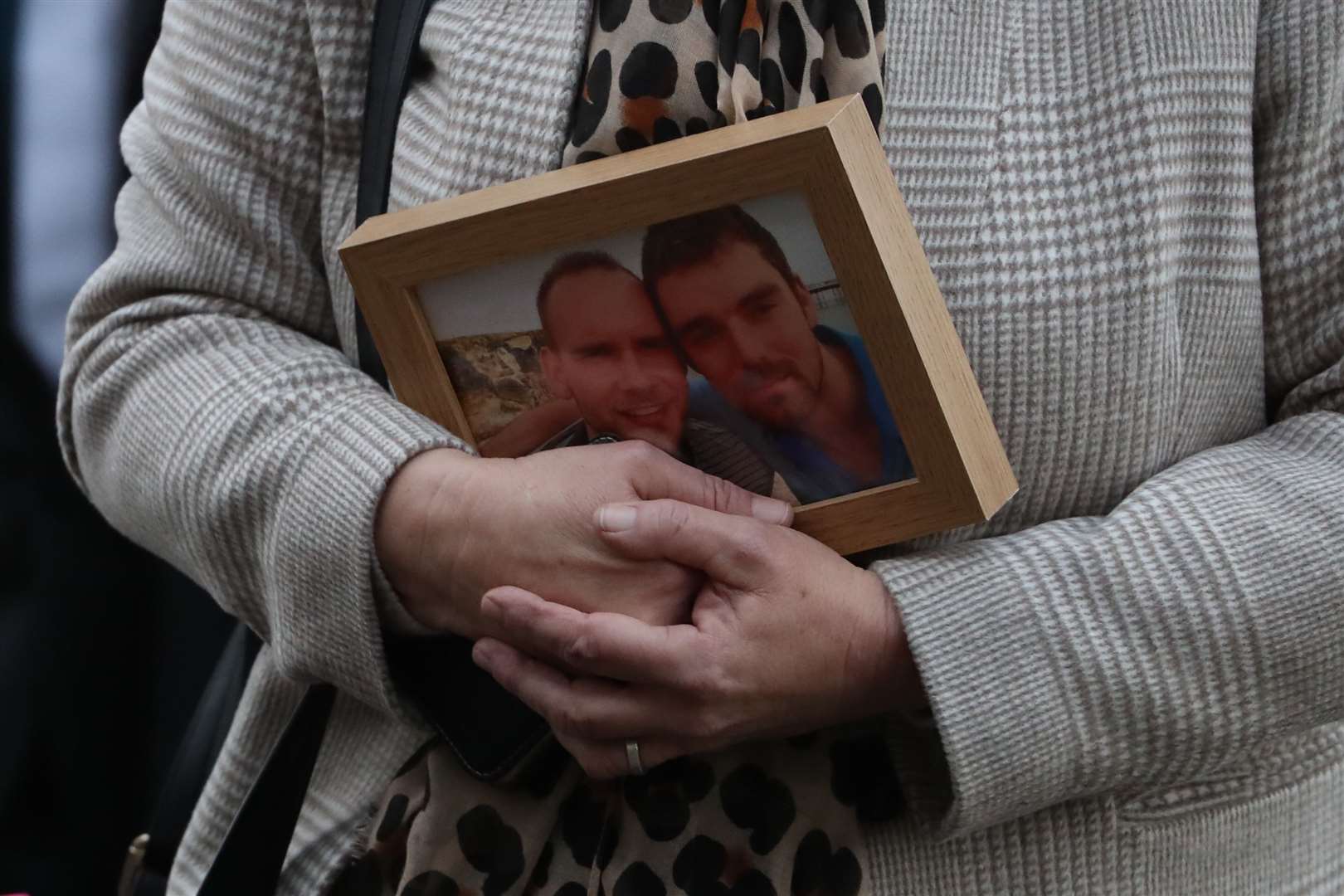 Simon Midgley’s mother Jane carried a photo of her son and Richard Dyson into the sentencing hearing (Andrew Milligan/PA)