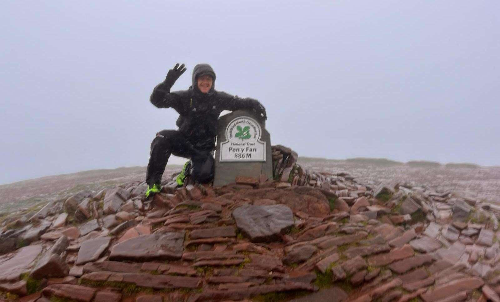 Matt Evans at the top of the Pen y Fan mountain in the Bannau Brycheiniog